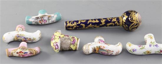 A collection of seven Dresden and Continental porcelain cane or parasol handles, late 19th / early 20th century, 6.4 - 14.8cm